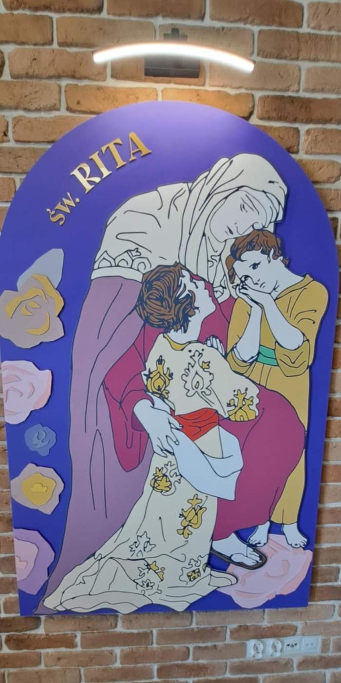 Obraz przedstawiający Św. Ritę, trzymającą w objęciach dwoje dzieci