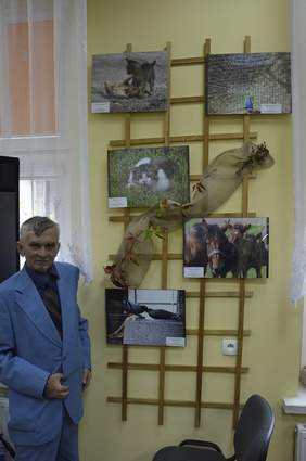 Pokaż zdjęcie: Laureat Konkursu fotograficznego na tle nagrodzonych prac