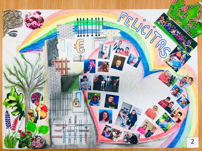 Pokaż zdjęcie: nagrodzony rysunek na którym namalowane jest serce otoczone tęczą, w sercu znajdują się fotografie uczestników wtz, obok serca narysowany jest fragment ogrodu z naklejonymi roślinami w prawym górnym rogu naklejona jest korona i napis felicitas