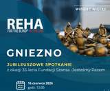 Plakat informacyjny o wydarzeniu REHA FOR THE BLIND IN POLAND. Na górze po lewej stronie napis: REHA FOR THE BLIND IN POLAND. Po prawej stronie u góry: WIDZIEĆ WIĘCEJ! Duży napis na środku: GNIEZNO. Poniżej: jubileuszowe spotkanie z okazji 35-lecia Fundacji Szansa – Jesteśmy Razem. Niżej, przy ikonie kalendarza: 16 czerwca 2026 godz. 12.00. 