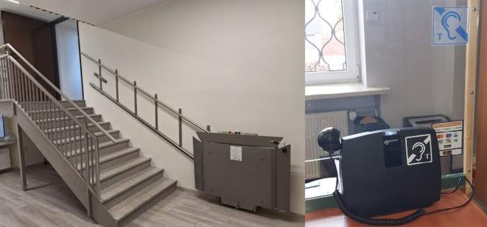 Pokaż zdjęcie: Po lewej stronie schody z metalowymi poręczami oraz platforma schodowa. Po prawej stronie pętla indukcyjna zainstalowana w punkcie obsługi klienta. W tle za szybą oddzielającą klientów od pracownika urzędu znajduje się okno oraz grzejnik.