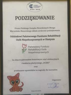 Pokaż zdjęcie: Na zdjęciu podziękowanie za objęcie patronatem honorowym zajęć edukacyjnych i konkursu plastycznego ,,Oczko’’ na białej kartce papieru z czarnej ramce